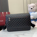 Blue embossed GG crossbody bag with front zip and metal logo tab