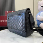 Blue embossed GG flap crossbody bag with black strap and gold-tone hardware