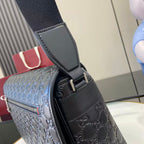 Gucci bag with embossed dark leather, adjustable strap and top handle