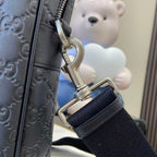 Gucci bag with metal clasp and adjustable webbing strap