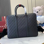 Gucci handbag in navy with GG monogram, dual handles and shoulder strap