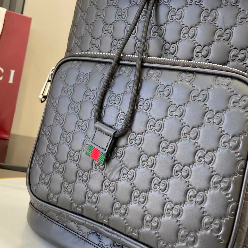 Gucci GG-embossed shoulder bag in dark gray with green-red web tag