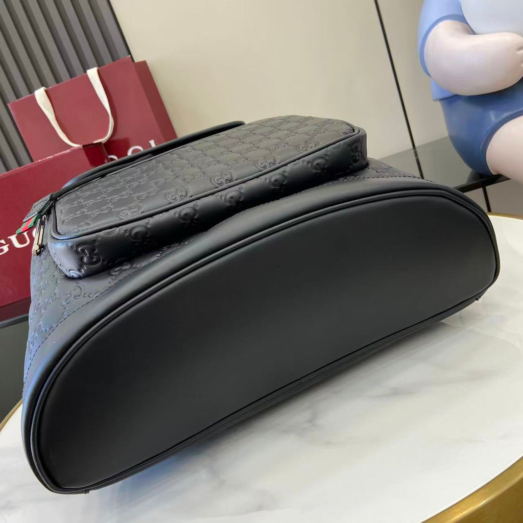 Gucci bag with curved top and embossed GG pattern, dark gray-black exterior