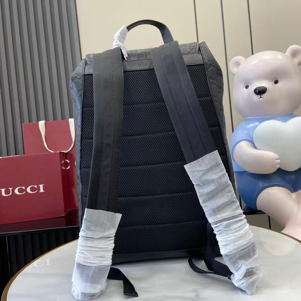 Gucci bag backpack back view with adjustable padded straps, dark blue-gray