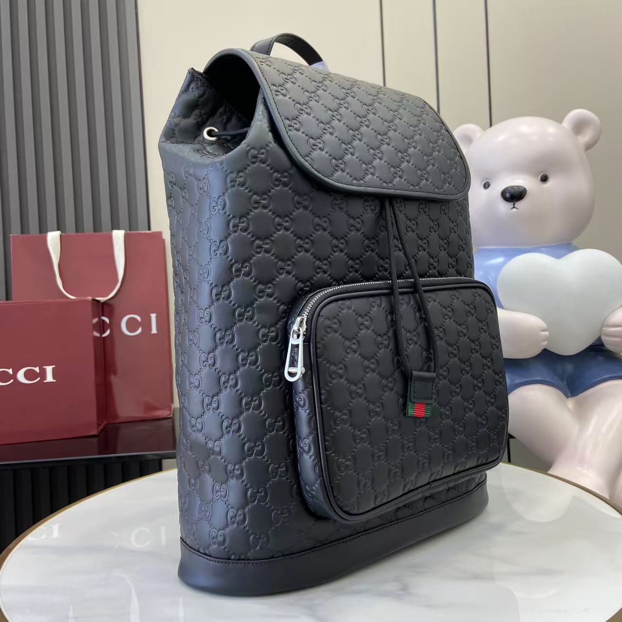 Gucci bag backpack with top flap and side zip pocket, embossed GG pattern, light blue-gray