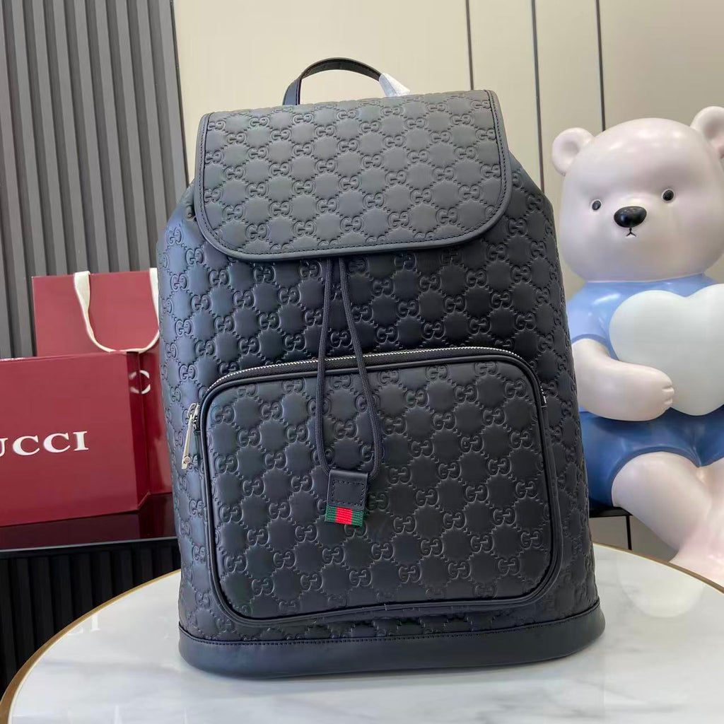 Gucci bag backpack with front flap pocket and embossed GG pattern, light blue-gray