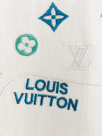 Louis Vuitton white T-shirt fabric closeup with Louis Vuitton logo