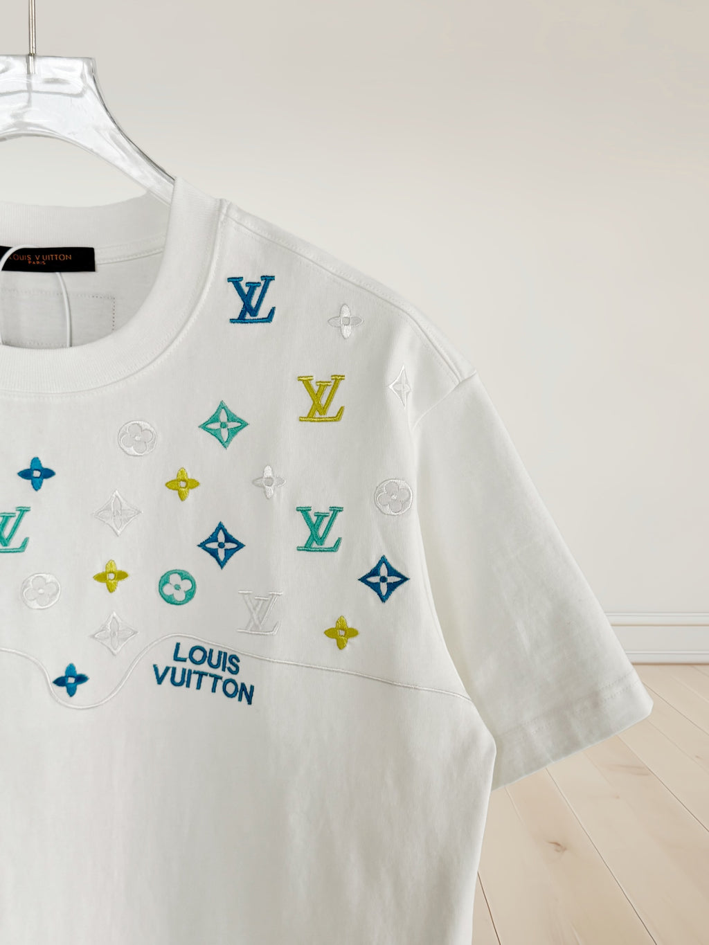 Louis Vuitton white T-shirt side view with multicolor icon logo