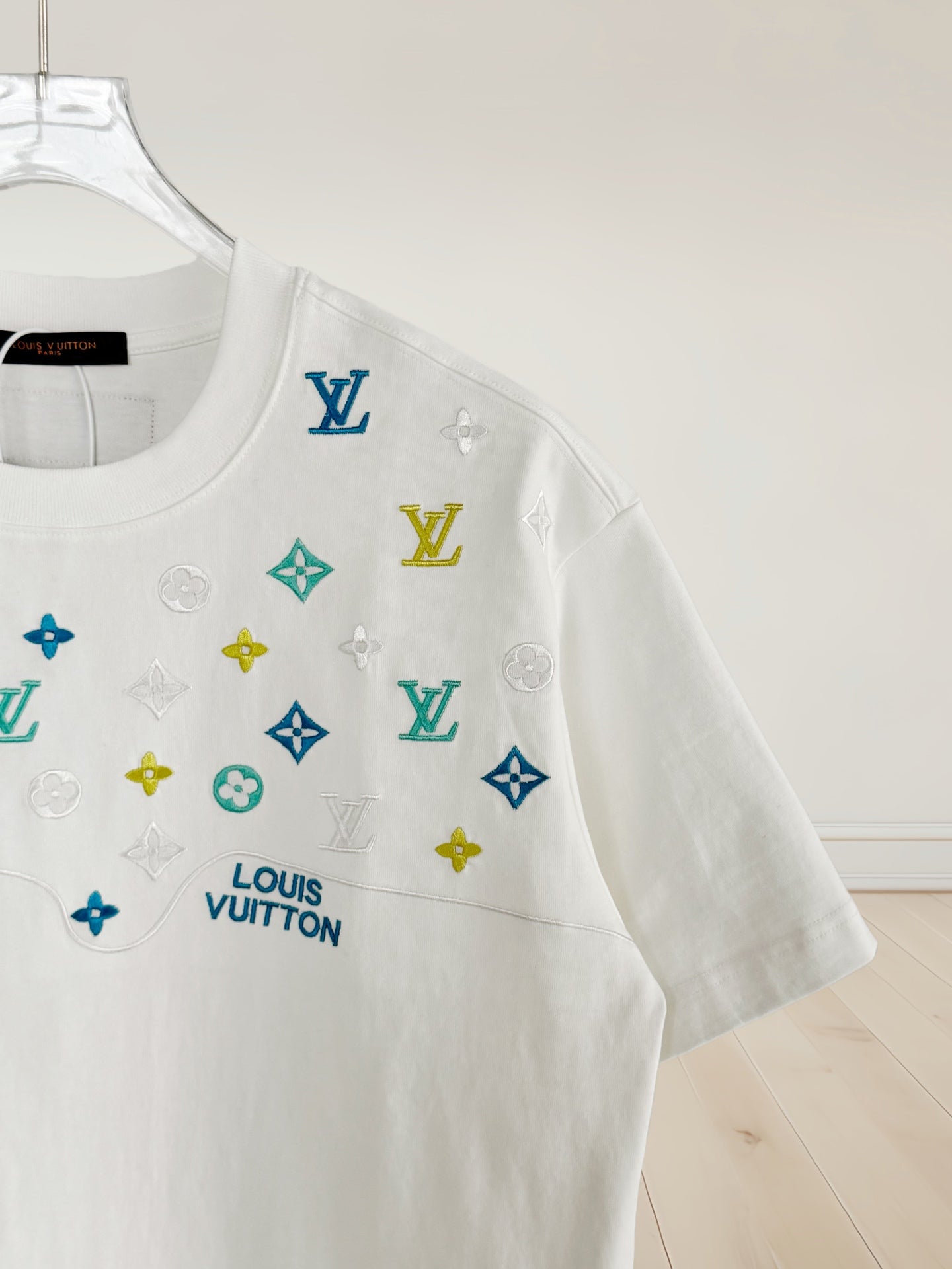 Louis Vuitton white T-shirt side view with multicolor icon logo