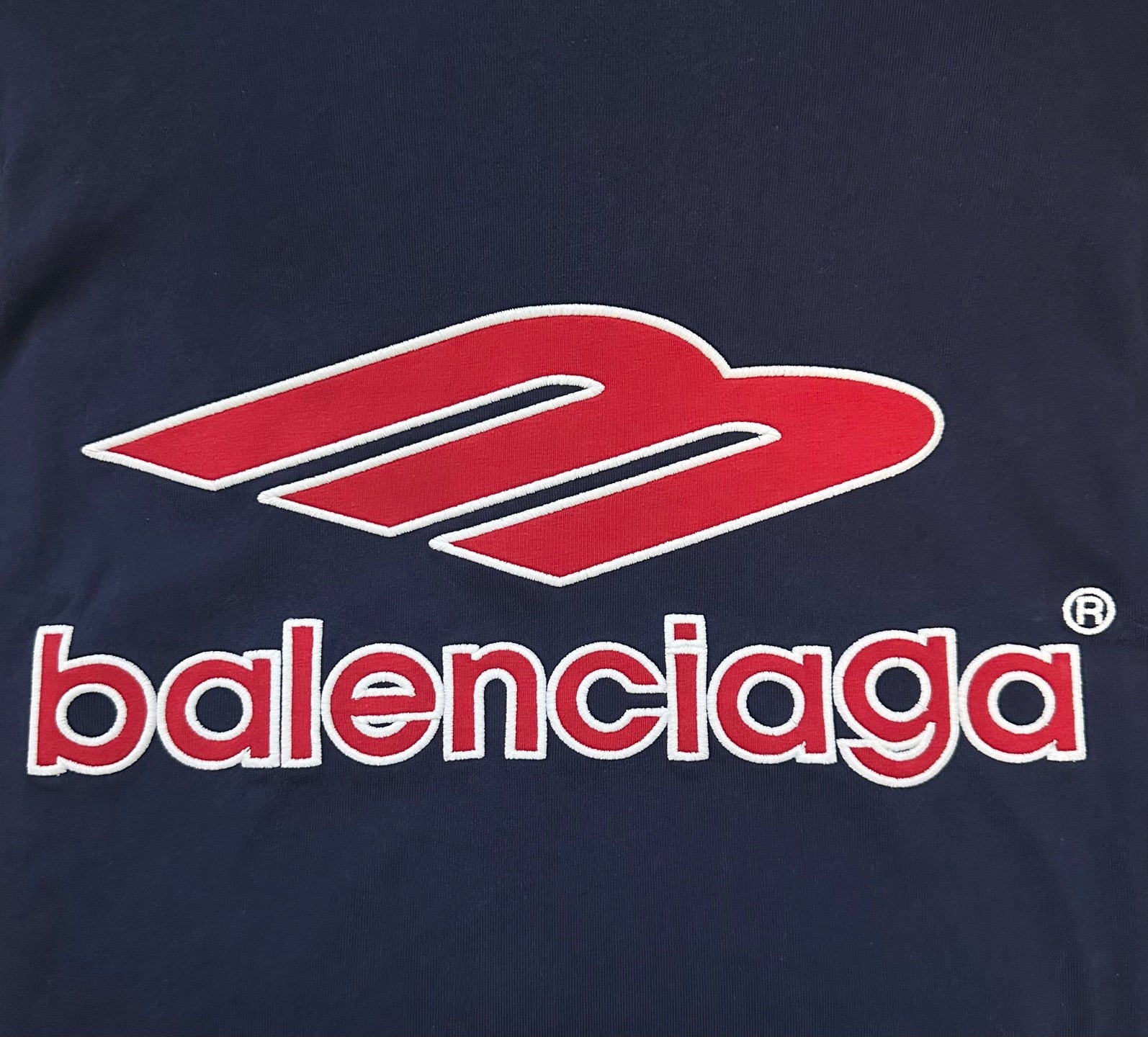 Balenciaga logo patch on navy sweatshirt in red and white
