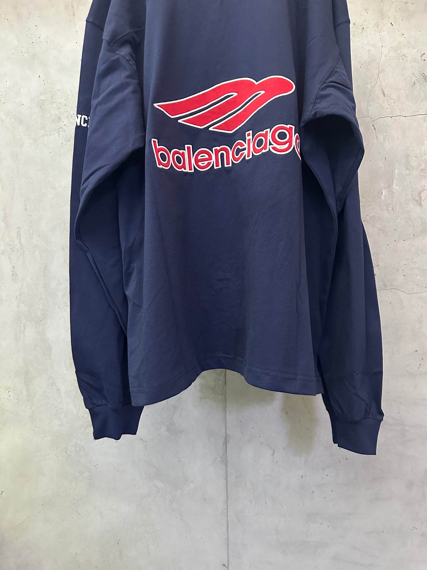 Balenciaga navy long-sleeve sweatshirt with red logo on back