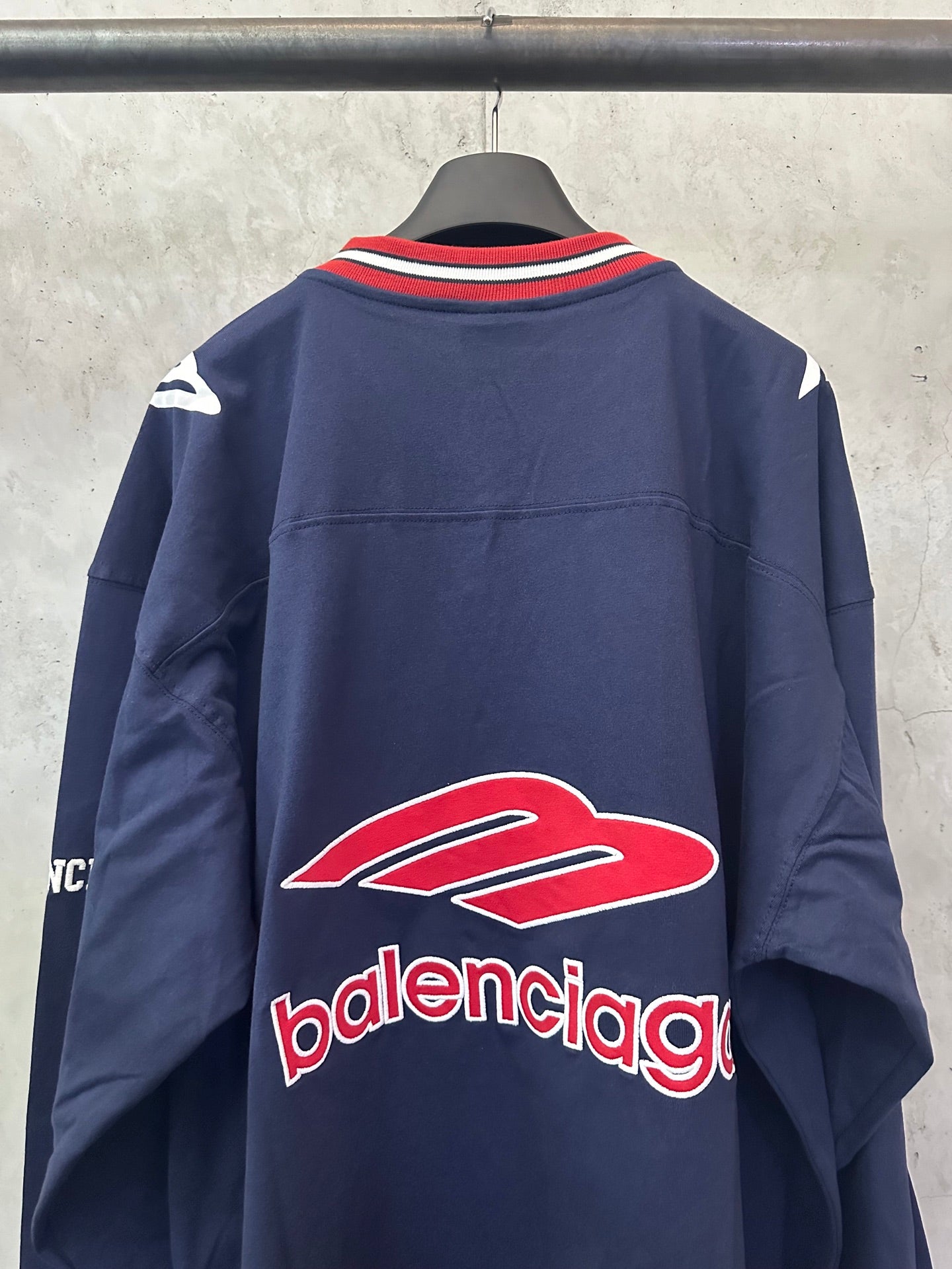Balenciaga navy sweatshirt back with large red logo and striped collar