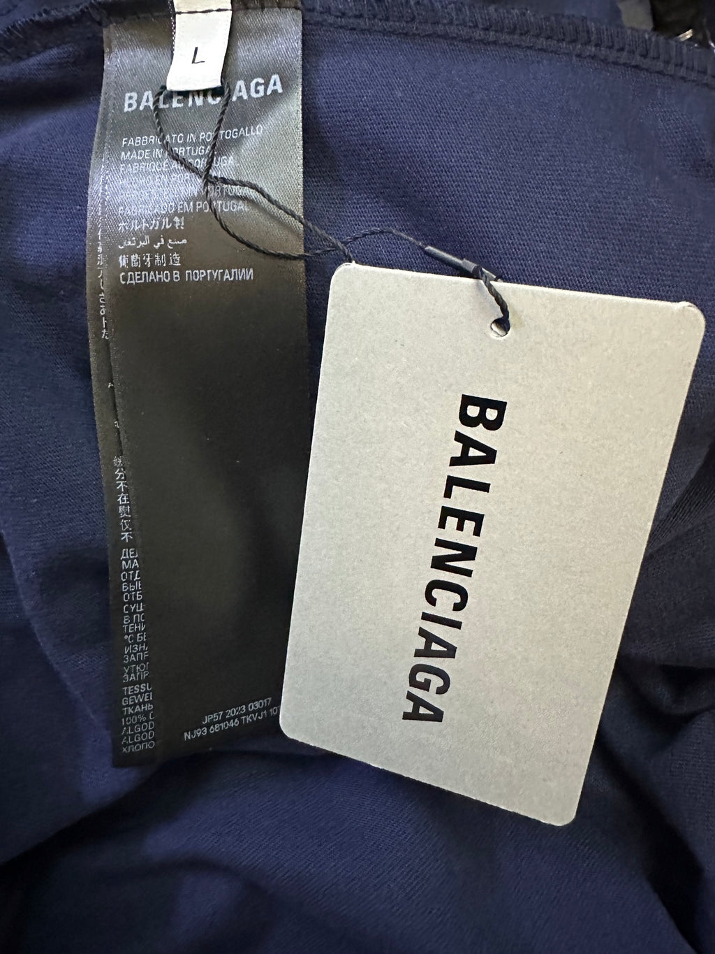 Navy short-sleeve shirt with inner label and hanging Balenciaga brand tag