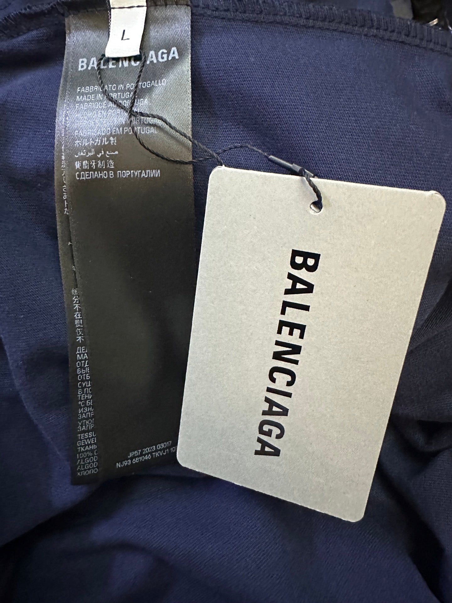 Navy short-sleeve shirt with inner label and hanging Balenciaga brand tag