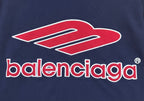 Close-up of navy short-sleeve polo shirt with red Balenciaga logo