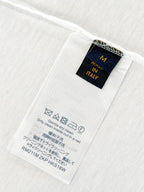 White T-shirt interior care label with size M and Made in Italy text