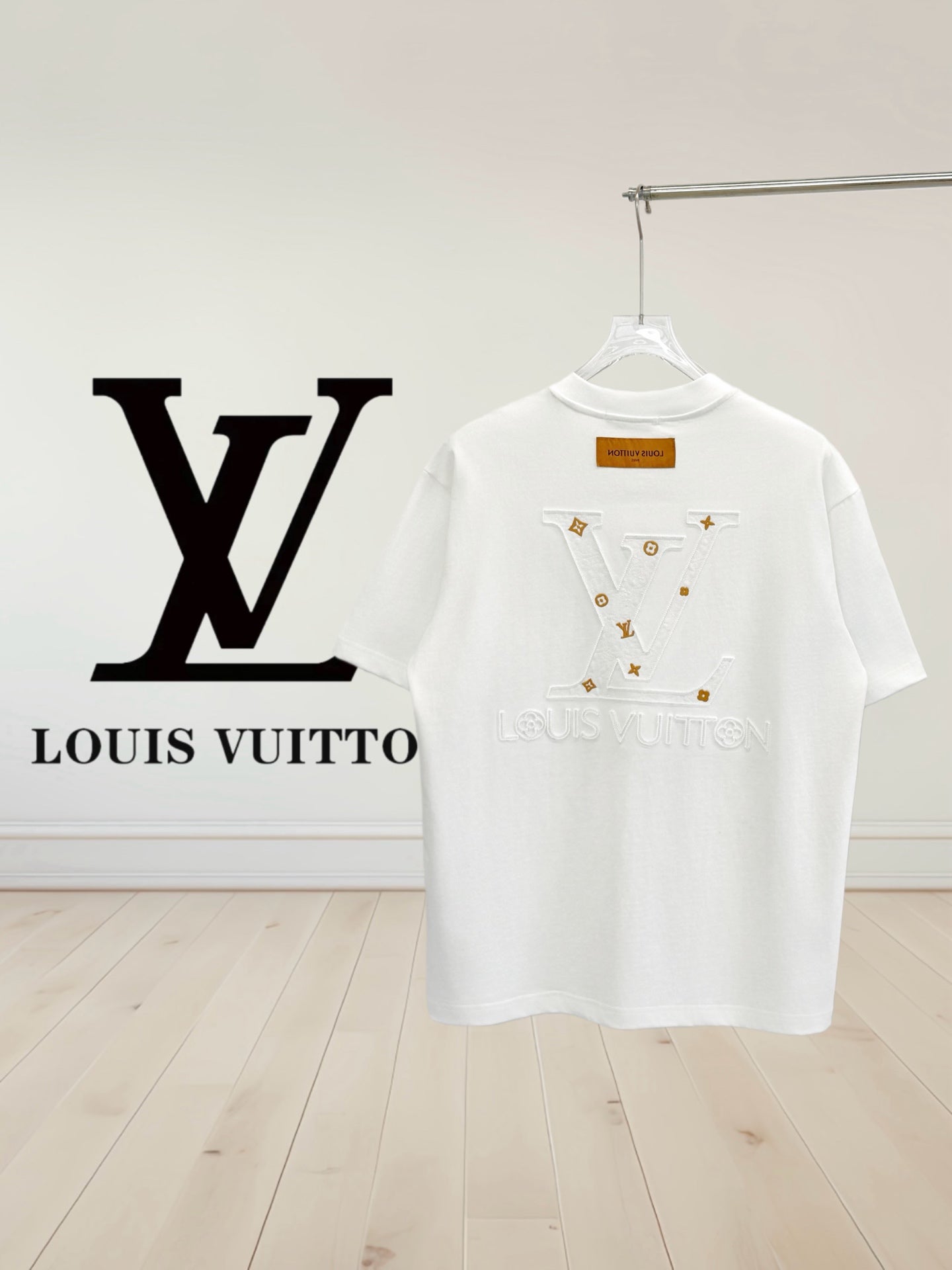 White T-shirt with centered multicolor emblem graphic on the upper back