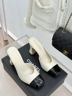 Chanel ladies mule heels, white upper with black patent toe caps and mid heel