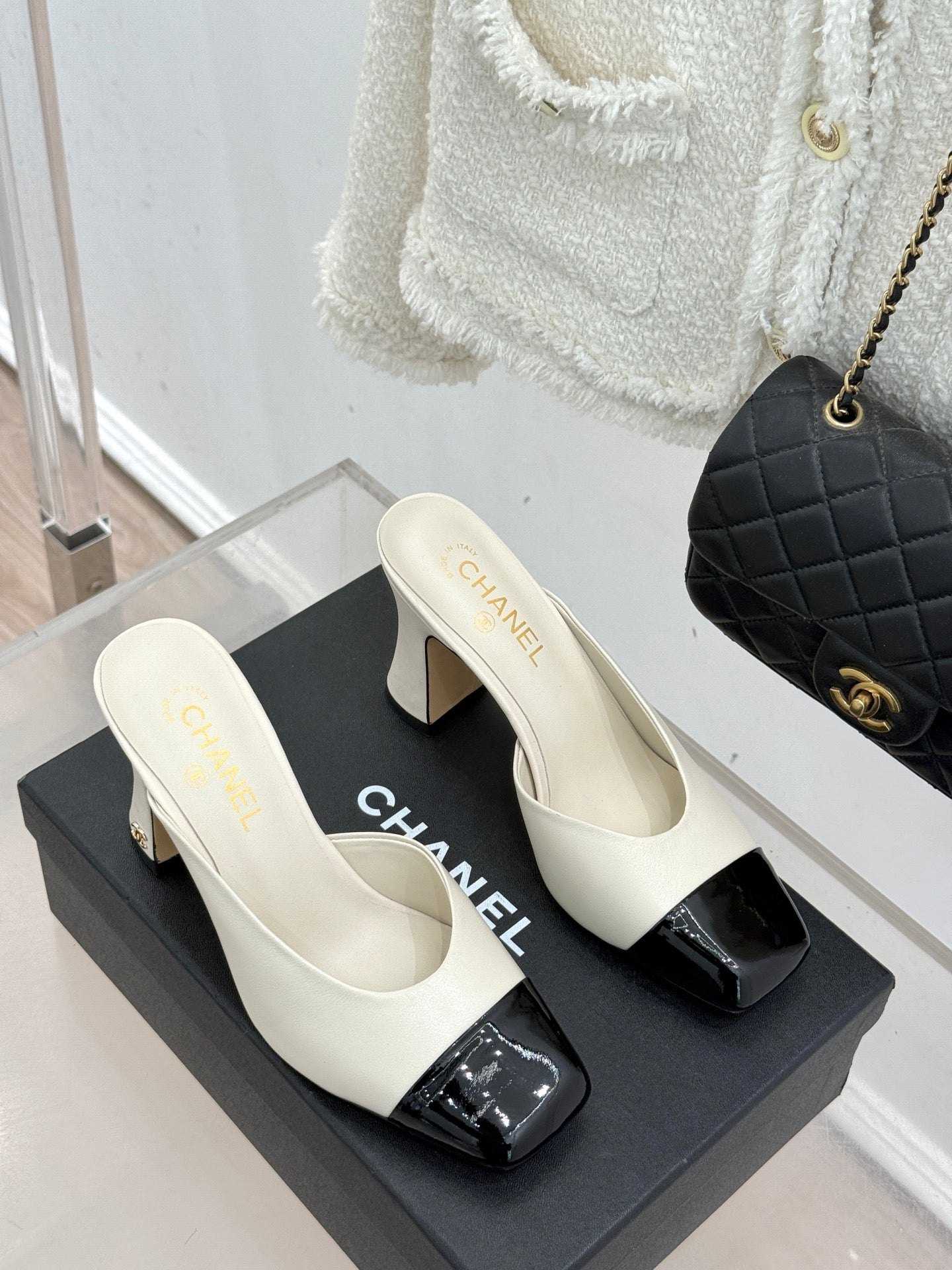 Chanel ladies mule heels, white upper with black patent toe caps and mid heel