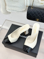 Chanel ladies mules on box, white with black glossy toe, chunky mid heel