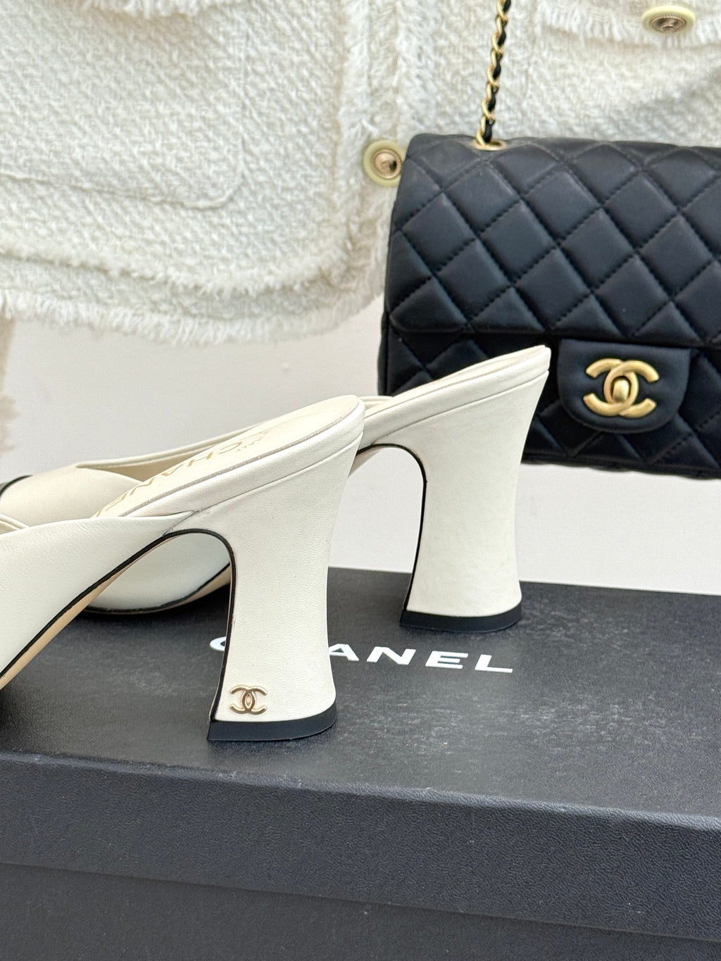 Chanel ladies mule heel close-up, white upper with sculpted block heel