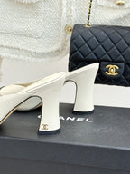Chanel ladies mule heel close-up, white upper with sculpted block heel