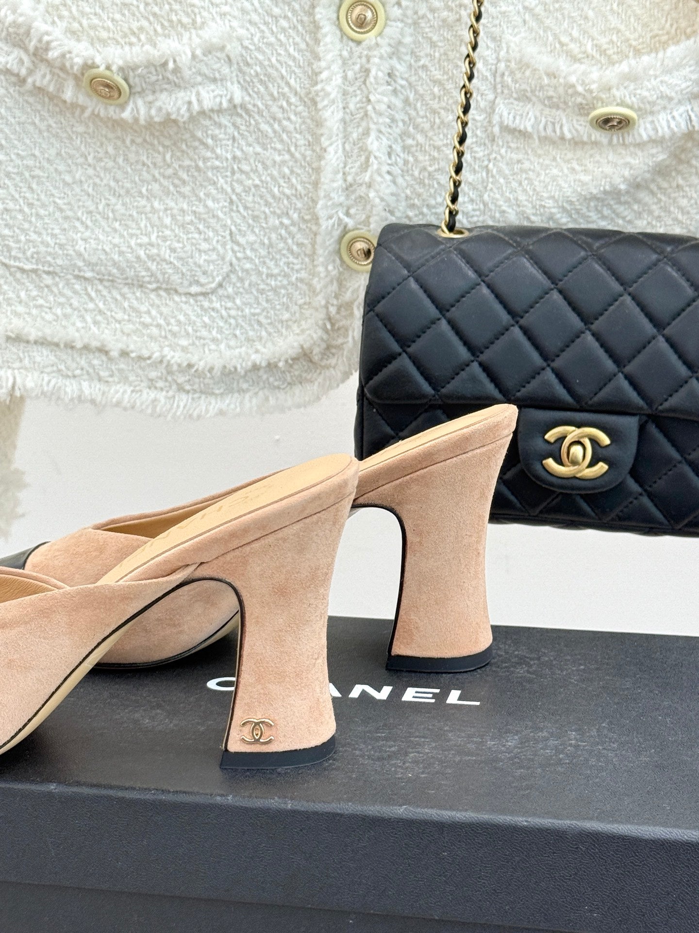 Beige suede mules with black patent vamp and tall block heels