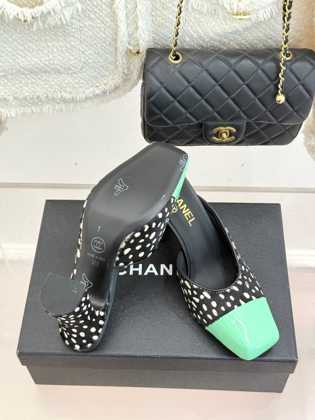 Mule heels with black-and-white spot uppers and mint green patent toe