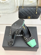 Mule heels with black-and-white spot uppers and mint green patent toe