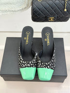 Mule heels with black-and-white spot uppers and mint green glossy toe caps