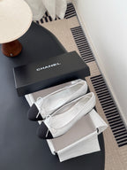 Two-tone leather ballet flats with lace-up bows, with white dust bag and box