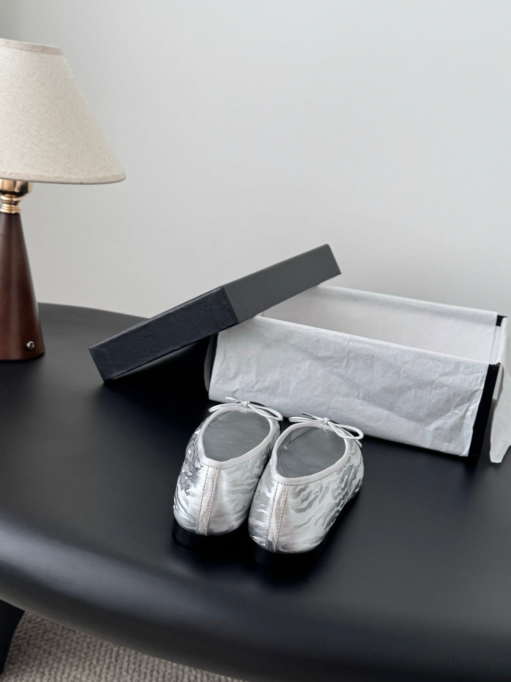Two-tone leather ballet flats with lace-up bows, front view