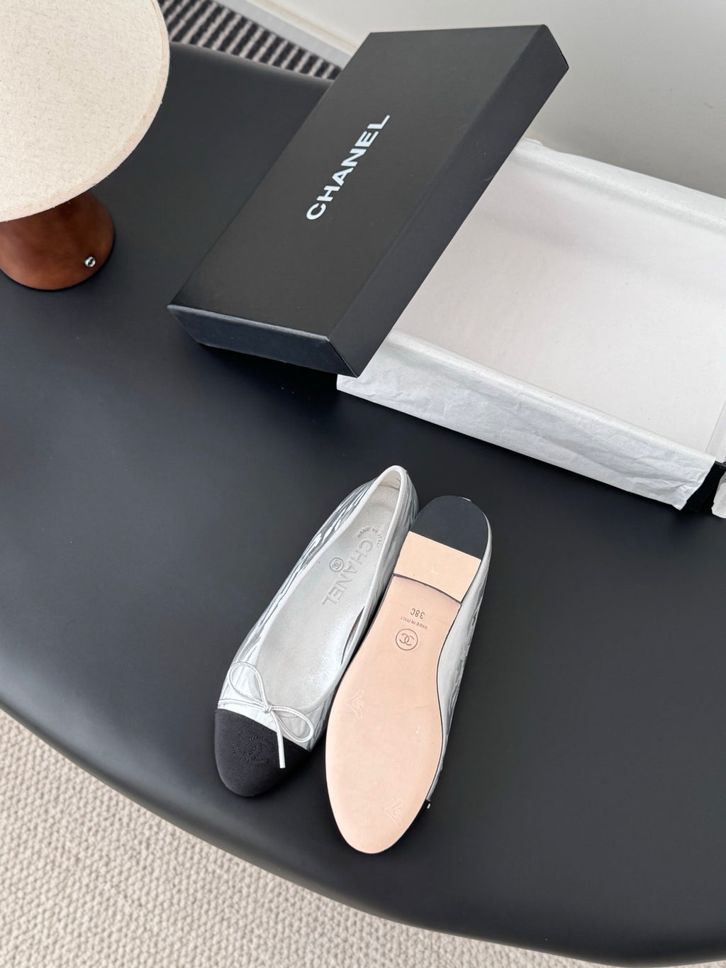 Two-tone leather ballet flats with lace-up bows and smooth interior lining
