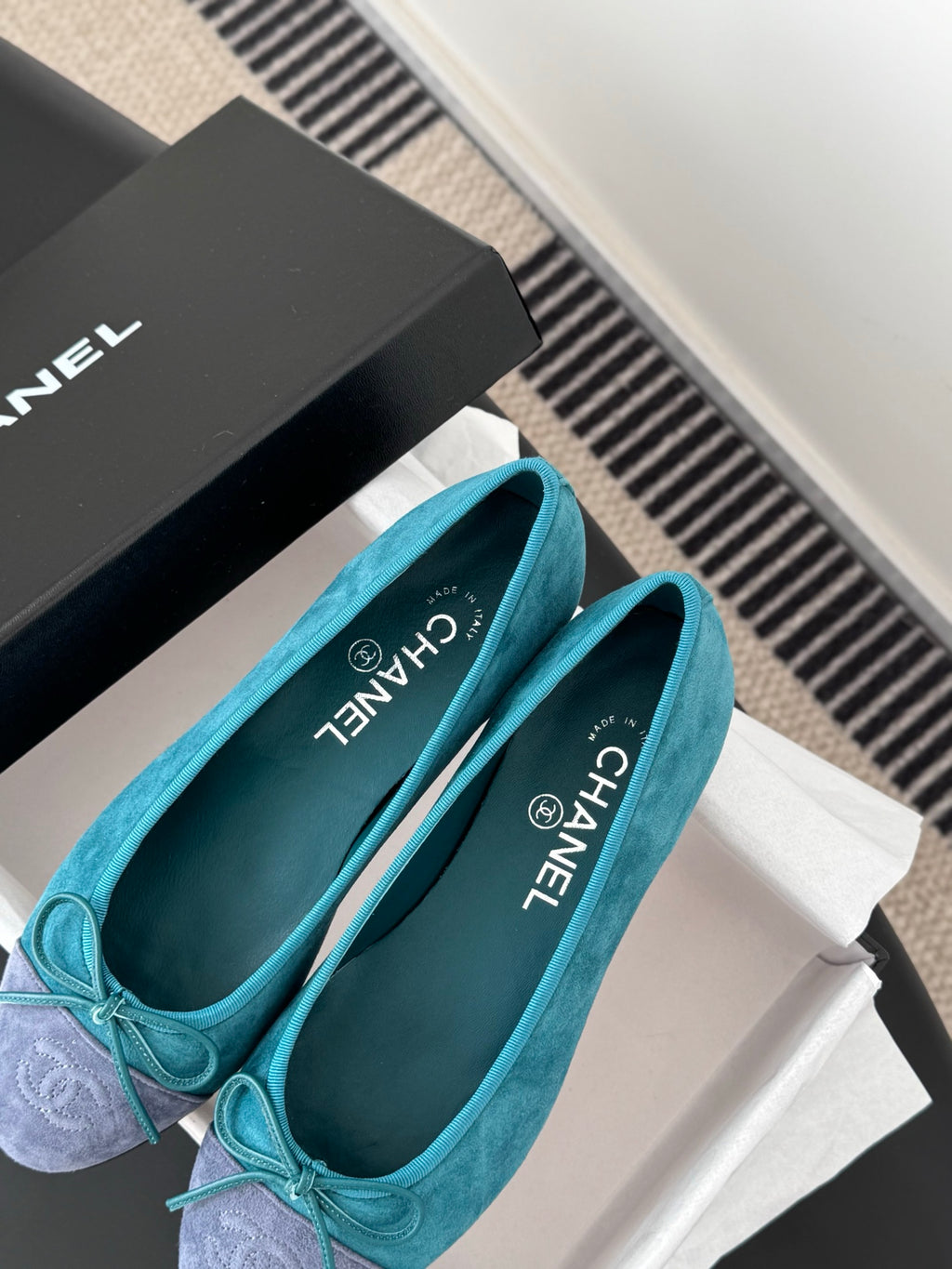 Pair of turquoise ballet flats with bow, rounded toe, Chanel logo on insole
