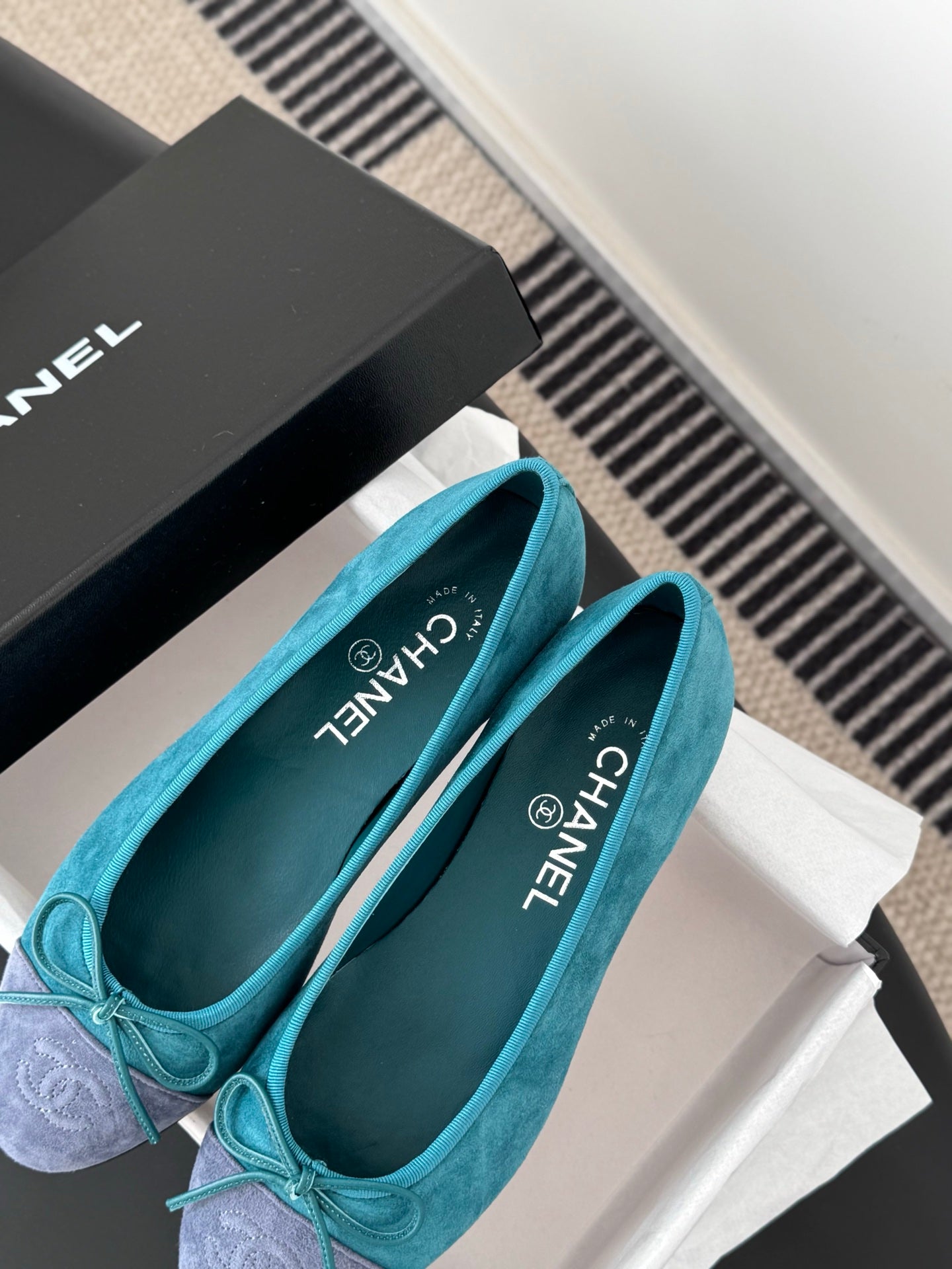 Pair of turquoise ballet flats with bow, rounded toe, Chanel logo on insole