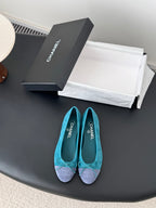 Turquoise ballet flats with bow at toe; fabric upper; Chanel logo on insole