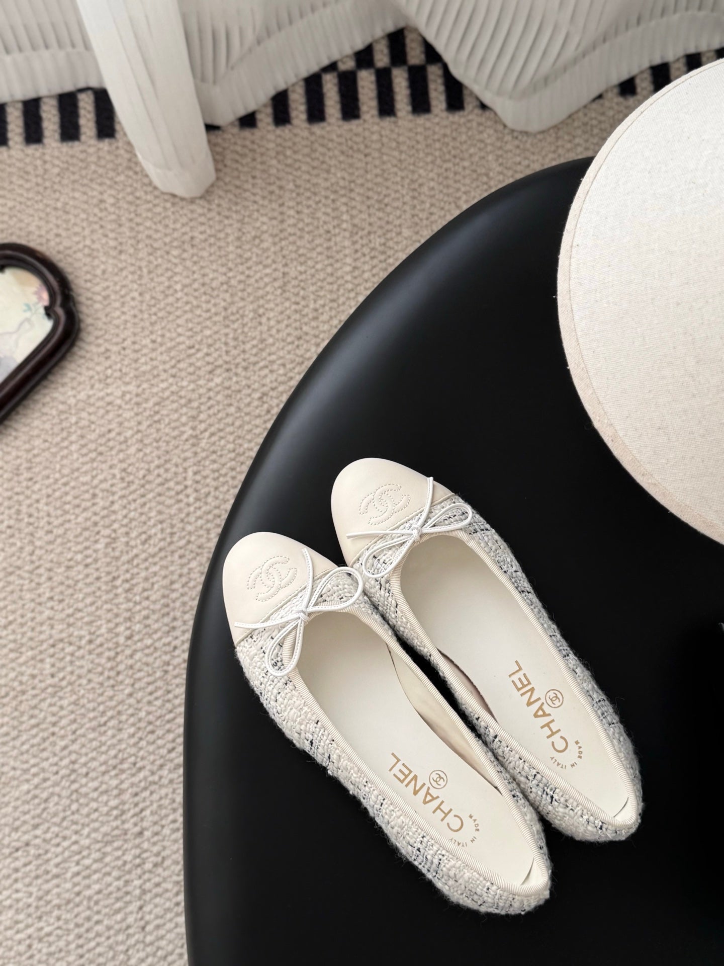 Cream tweed ballet flats with lace-up bows and embroidered logos