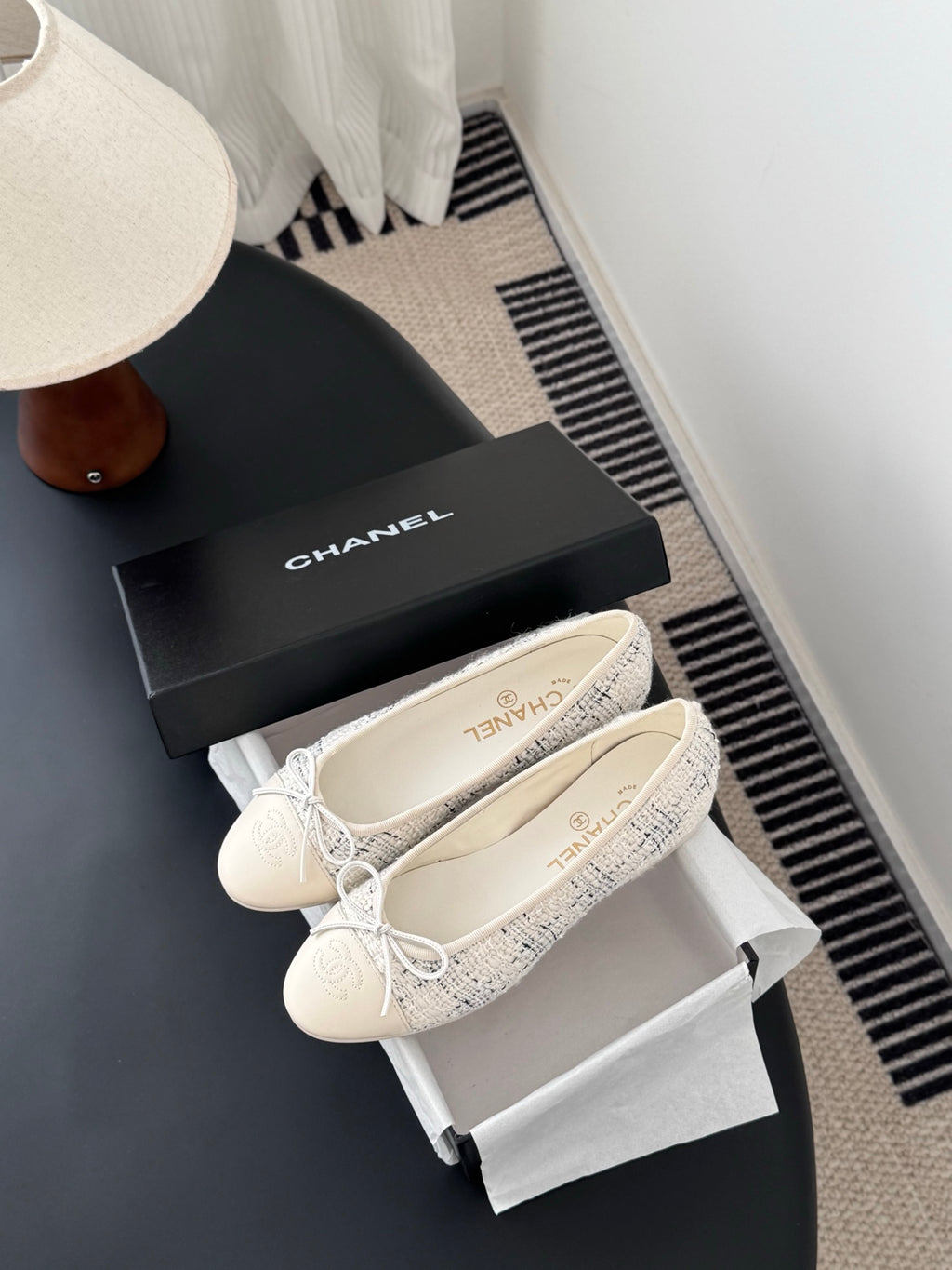 Cream tweed ballet flats with lace-up bows, with black Chanel-style box