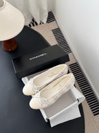 Cream tweed ballet flats with lace-up bows, with black Chanel-style box