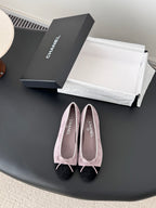 Chanel two-tone suede ballet flats with black toe cap and pink bow ties