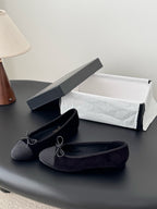 Dark lace-up ballet flats with bow laces, side view, logo insoles
