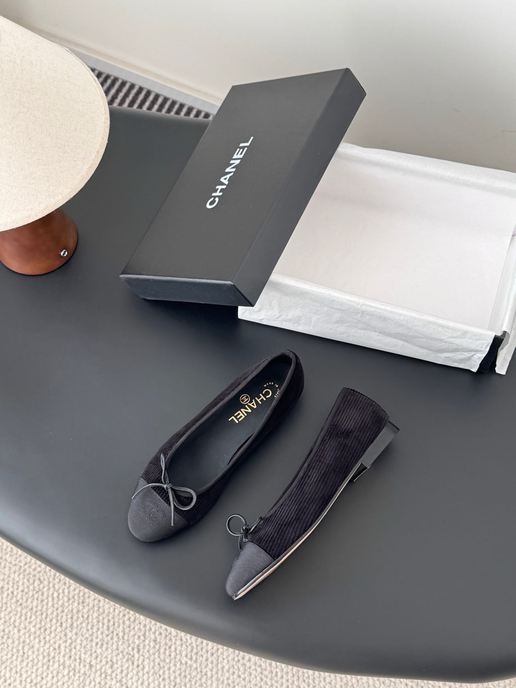 Dark fabric ballet flats with bow ties and CHANEL logo insoles