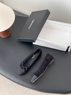 Dark fabric ballet flats with bow ties and CHANEL logo insoles