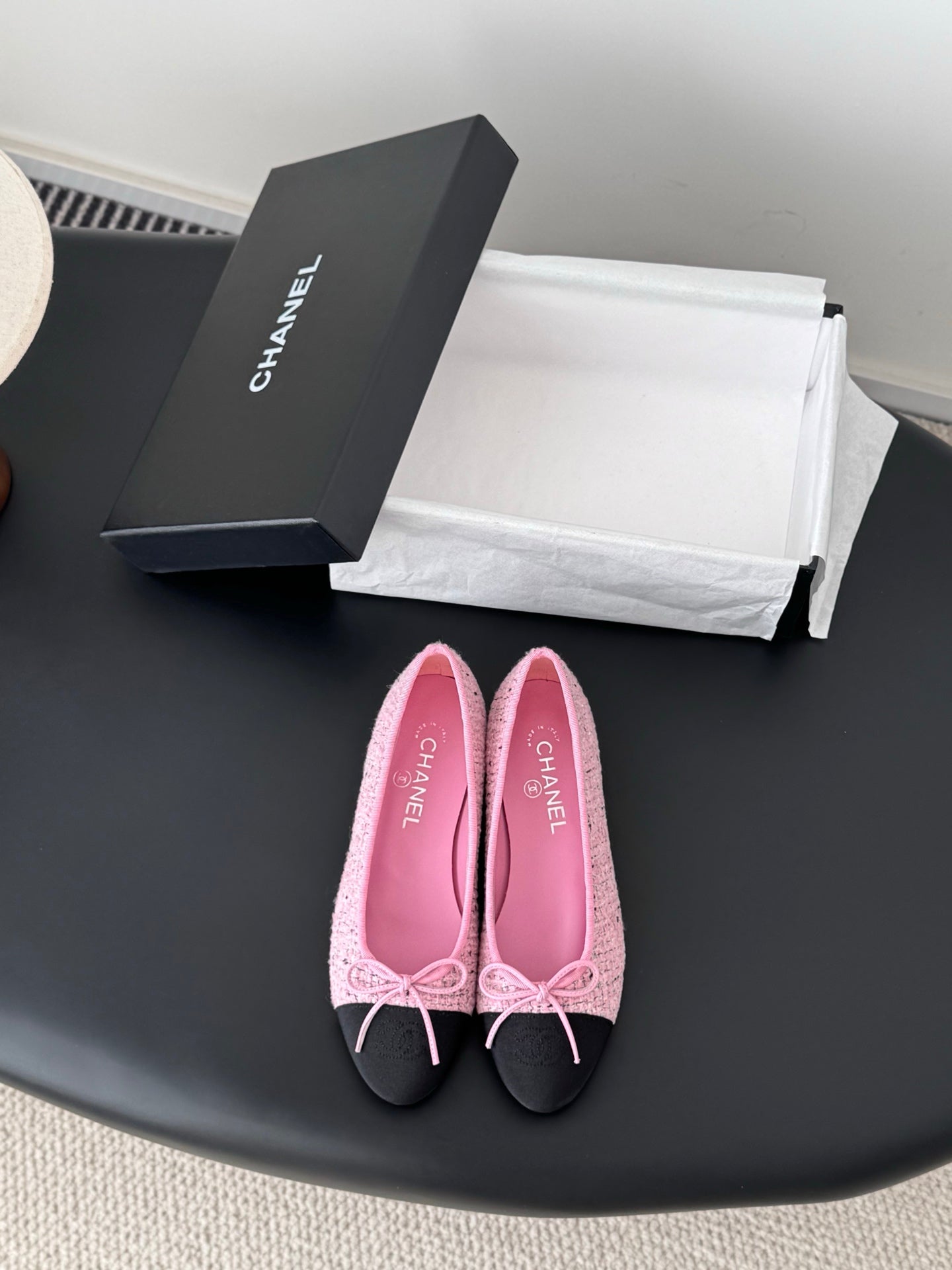 Chanel ladies pink tweed ballet flats with black toe and bow detail