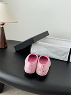Chanel ladies pink tweed ballet flats viewed from back with bow ties