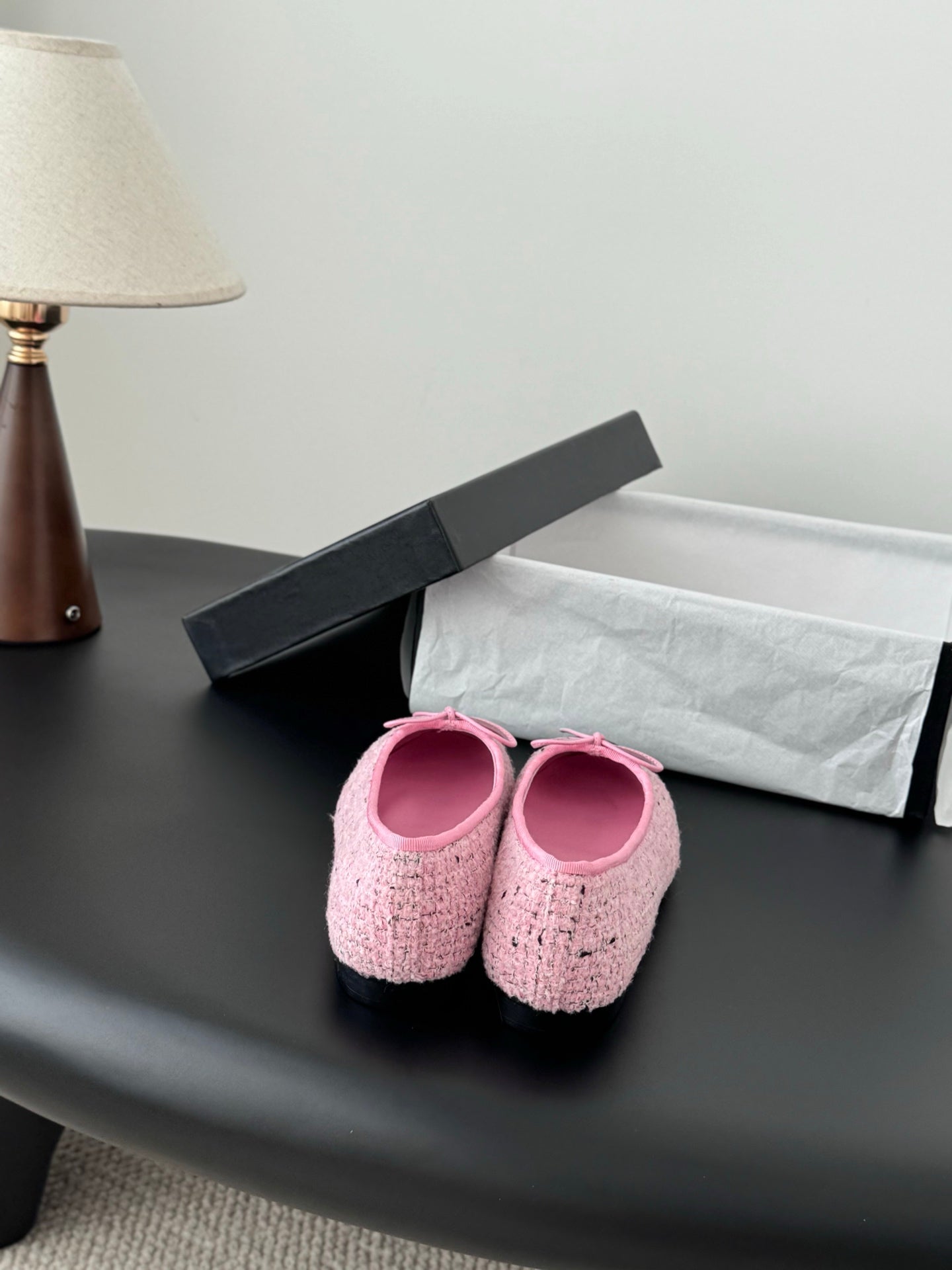 Chanel ladies pink tweed ballet flats viewed from back with bow ties