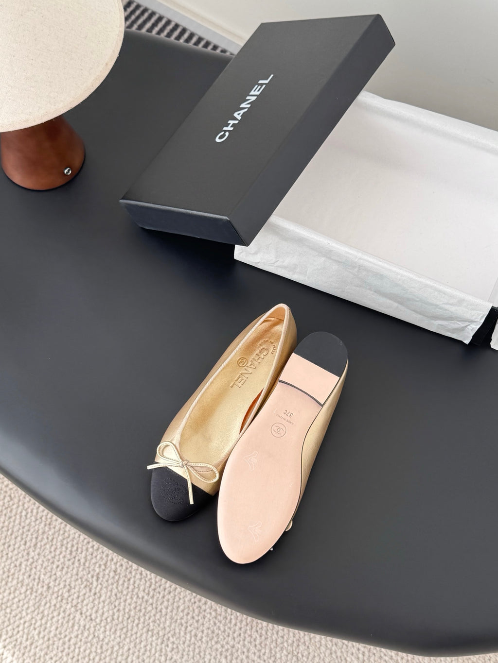 Chanel ladies slip-on flats, beige and black with bow tie detail