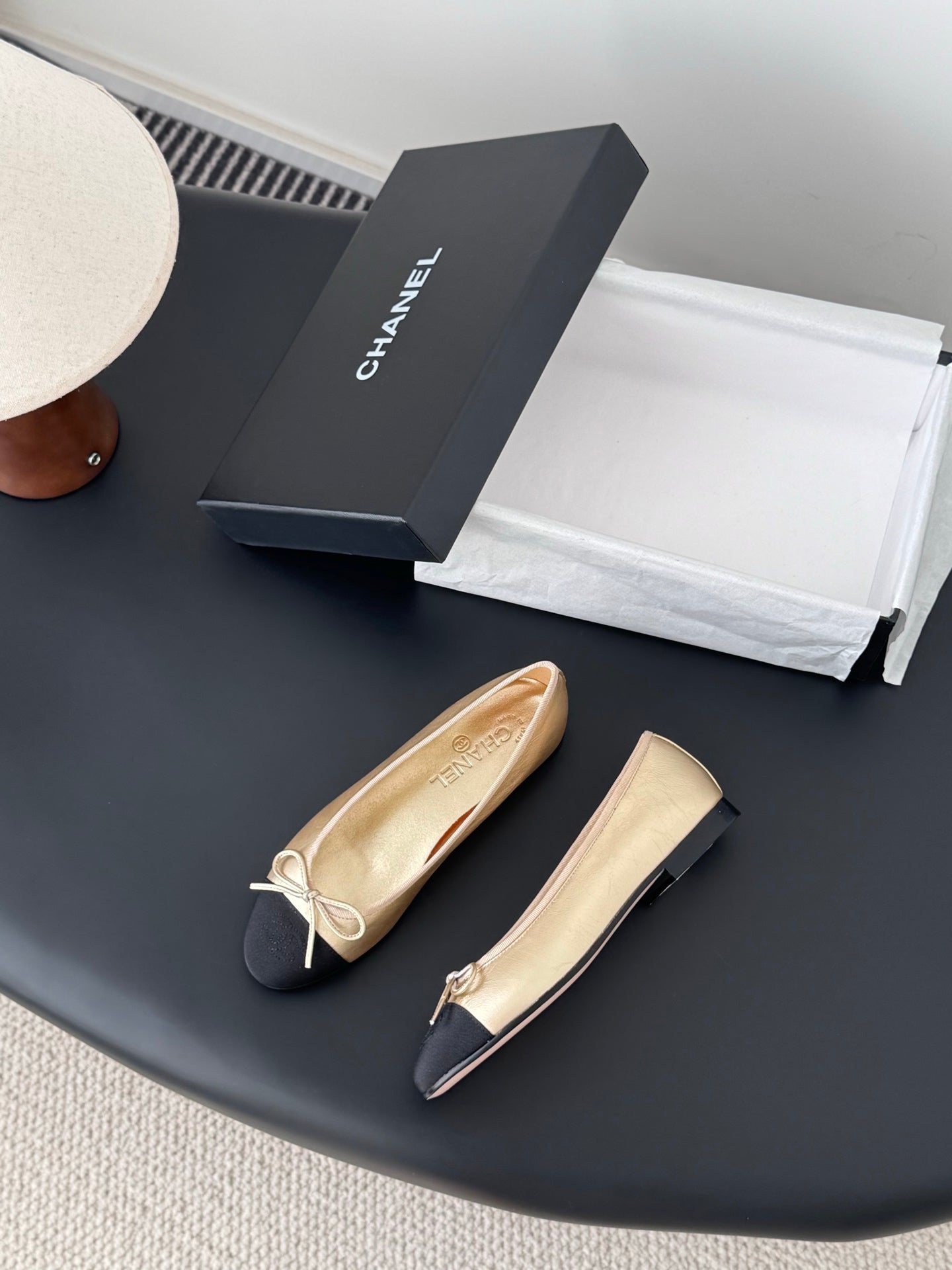 Chanel ladies ballet flats pair, beige with black toe caps and lace bows