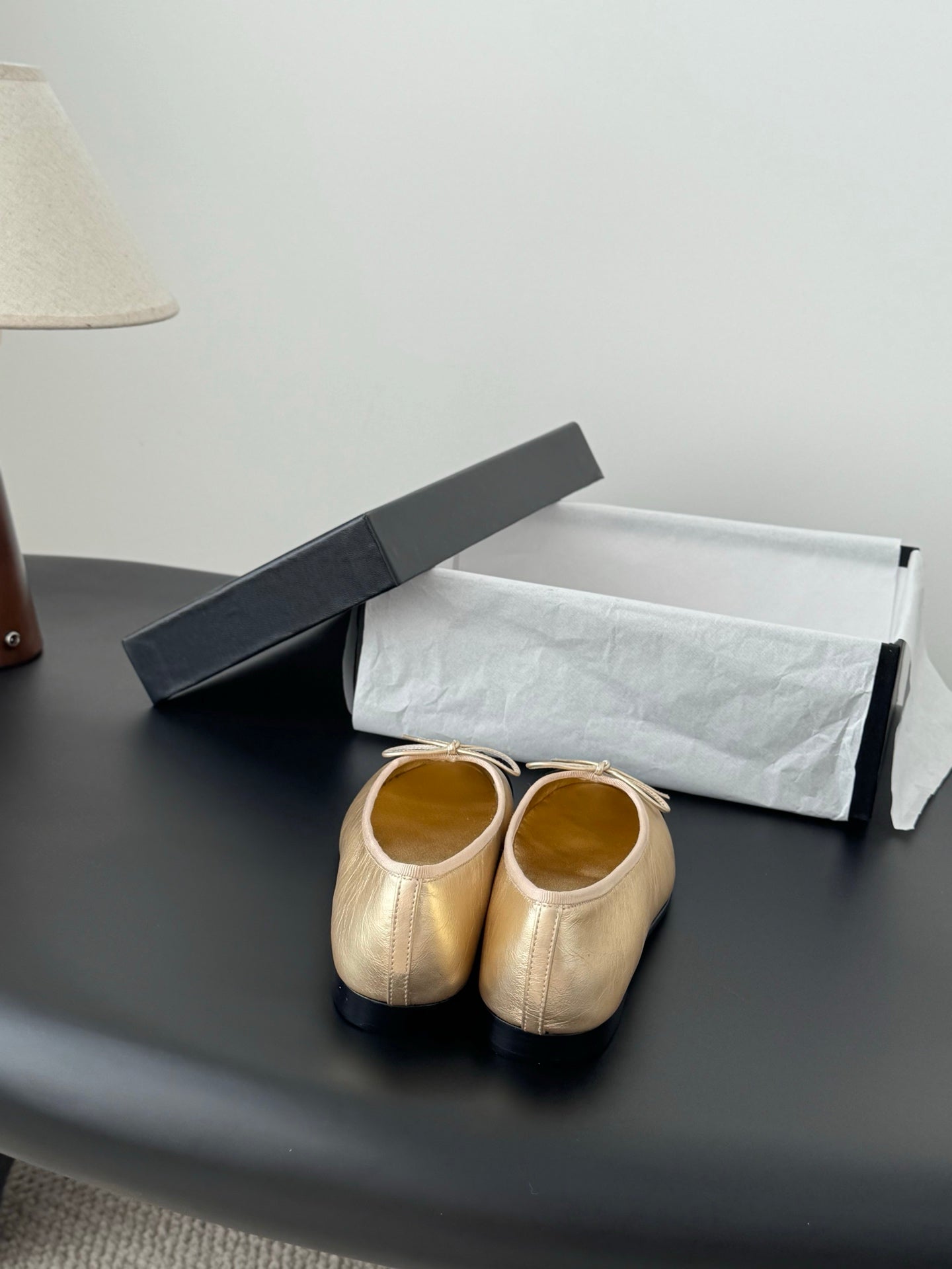 Chanel ladies flats, beige with black toe caps, heels facing up