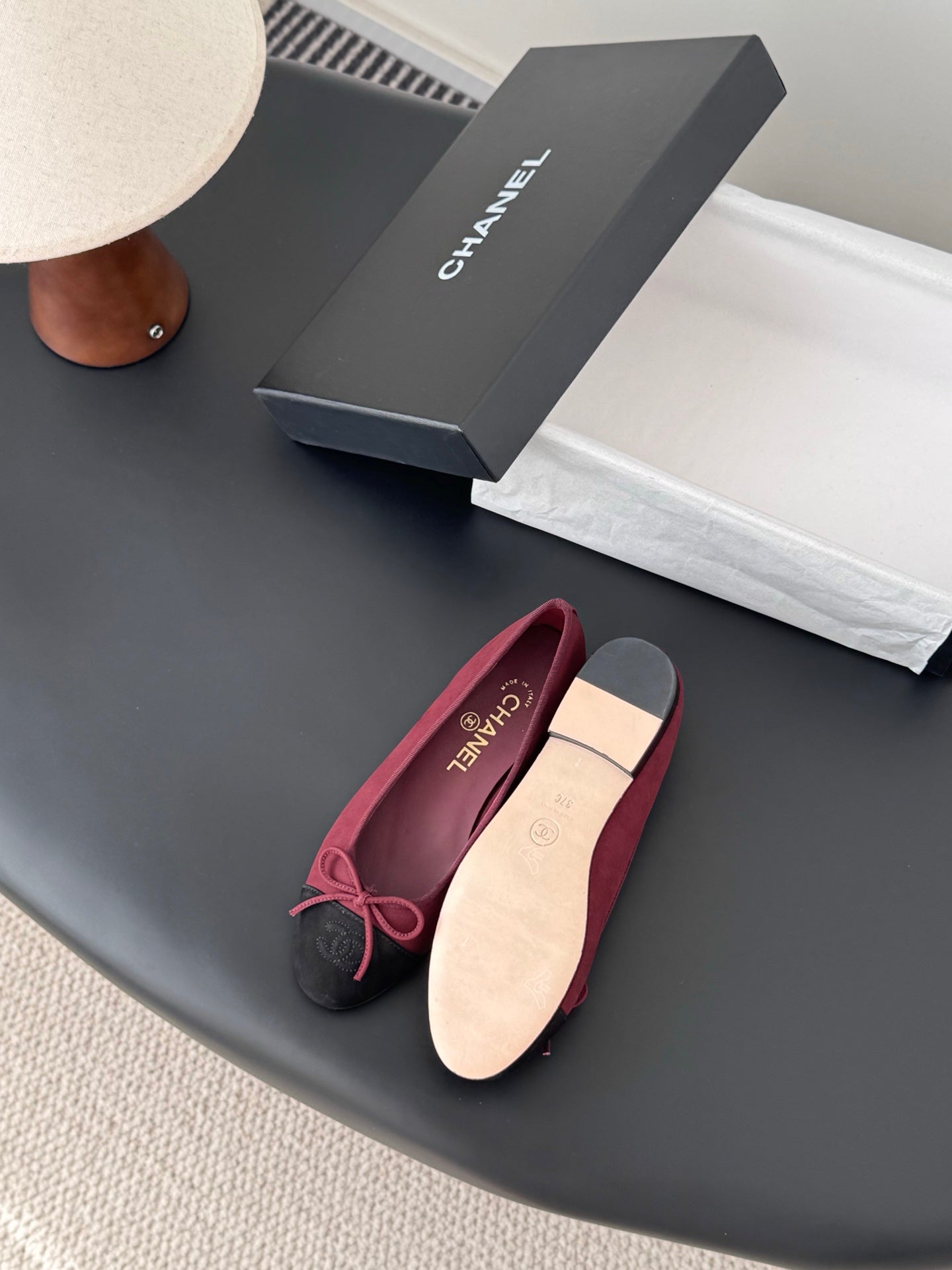 Chanel ballet flats with burgundy upper and black toe cap, pink bow and light insole